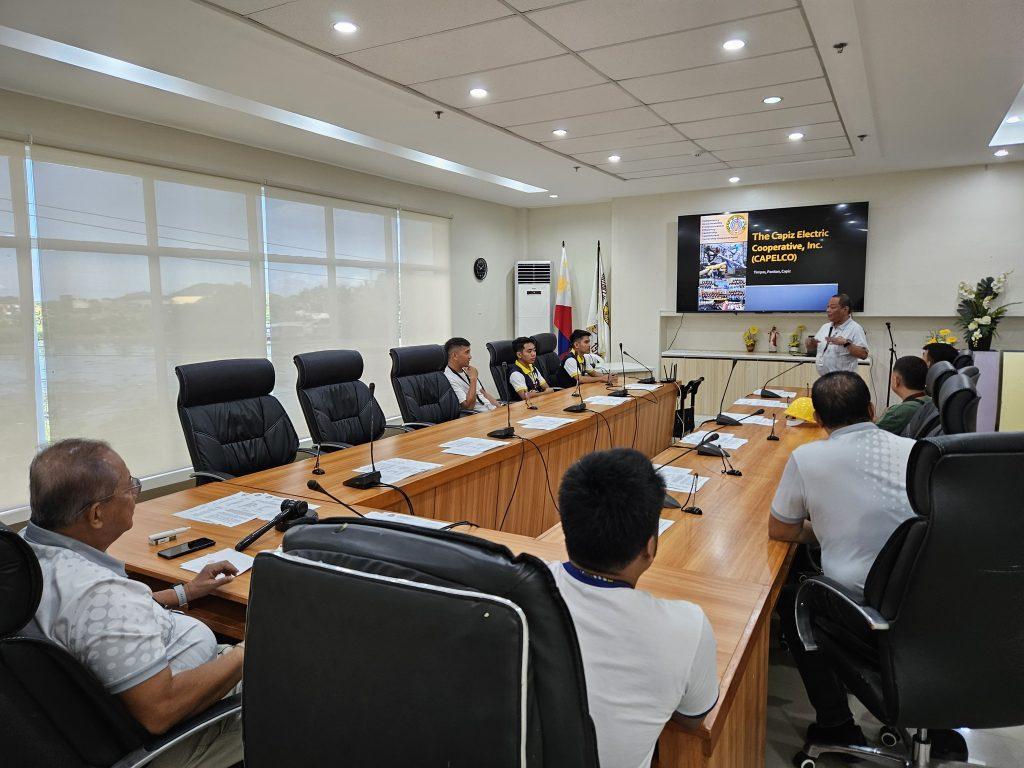 Rey Cordenillo talking in front of his colleagues at The Capiz Electric Cooperative Incorporated or CAPELCO